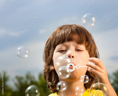 boy play in bubbles