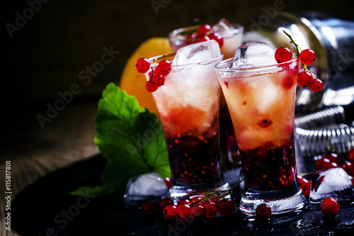 Alcoholic cocktail summer fizz with orange and redcurrant  selec