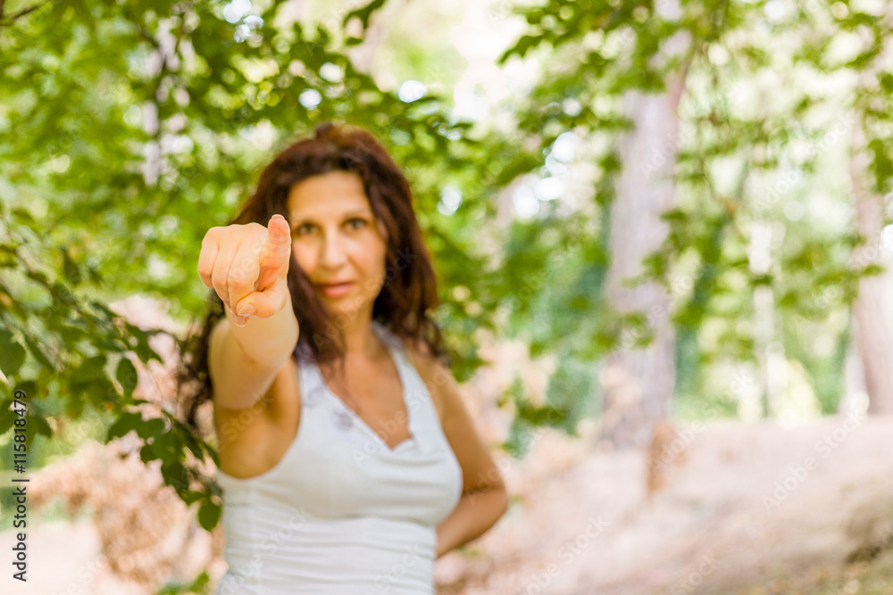 woman pointing toward the viewer woman pointing toward the viewer
