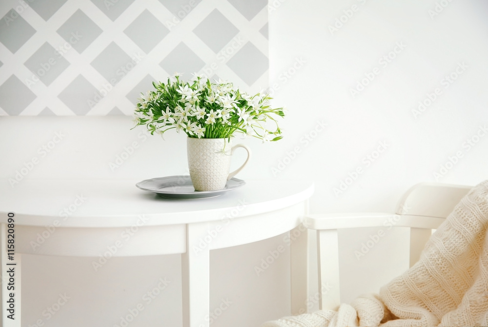 Fototapeta premium Bouquet of little white flowers on light background