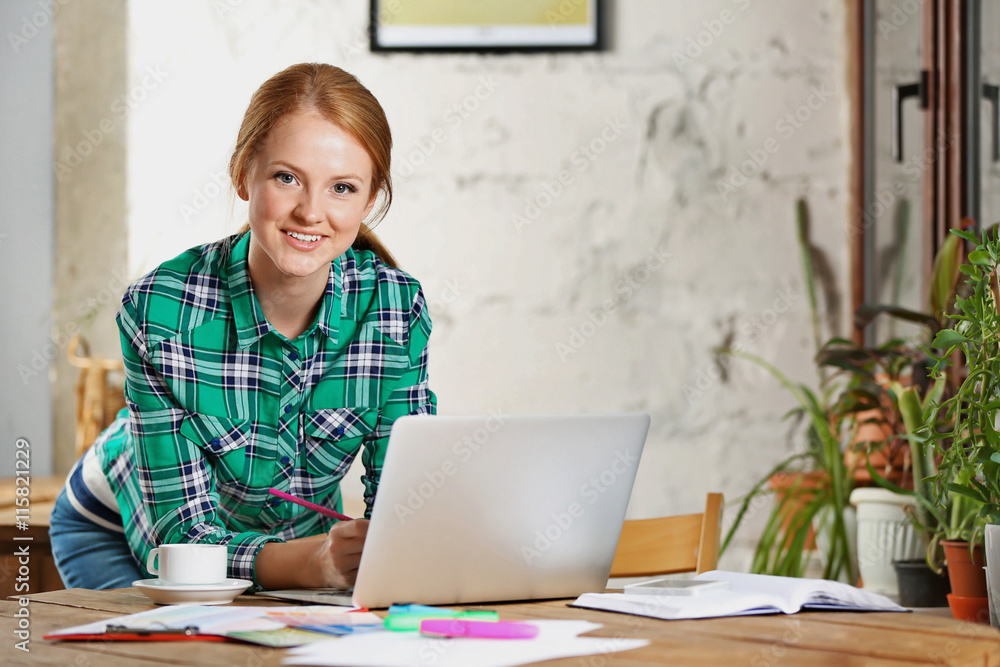 Creative girl working with laptop in office Creative girl working with laptop in office