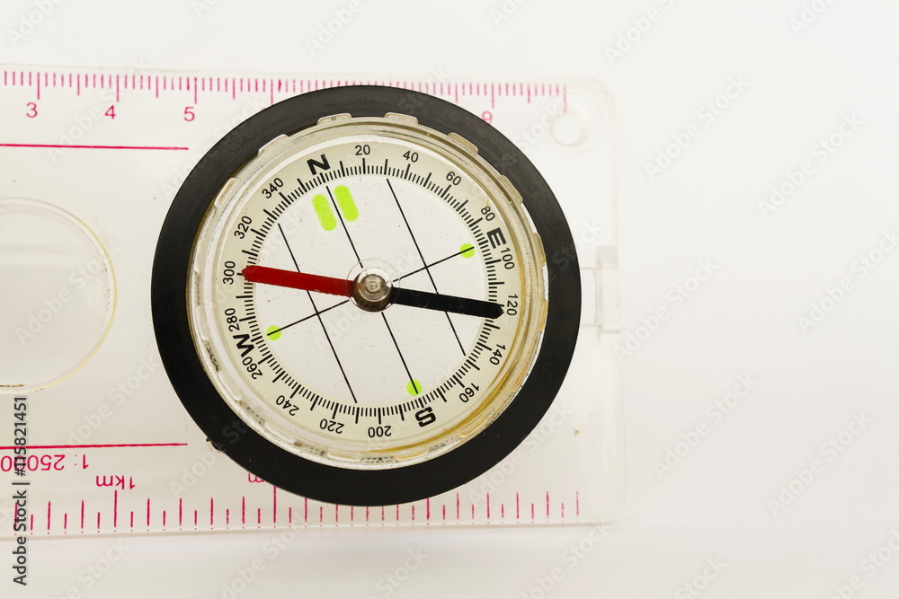 Detail shot of a glass compass on white background Detail shot of a glass compass on white background