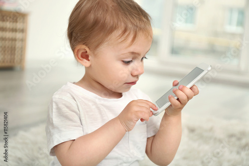 Cute baby girl playing with...