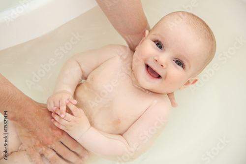 Cute baby bathing