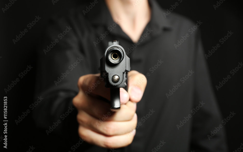 Man with gun on black background Man with gun on black background