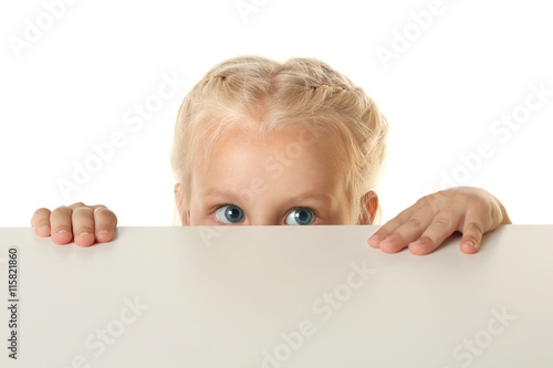 Funny little girl hiding be...