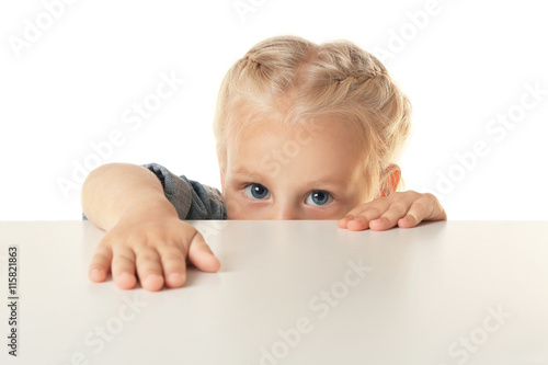 Funny little girl hiding be...