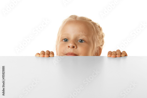 Funny little girl hiding be...