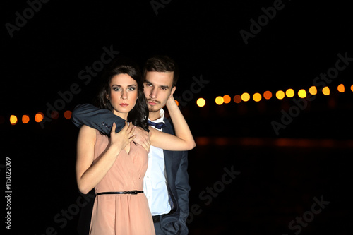 Beautiful young couple posi...