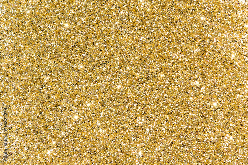 Gold sequins. Bright shine. Yellow powder. Glitter. Shining background  Stock Photo | Adobe Stock
