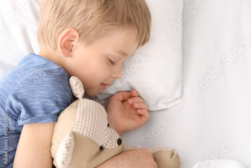 Adorable little boy sleepin...