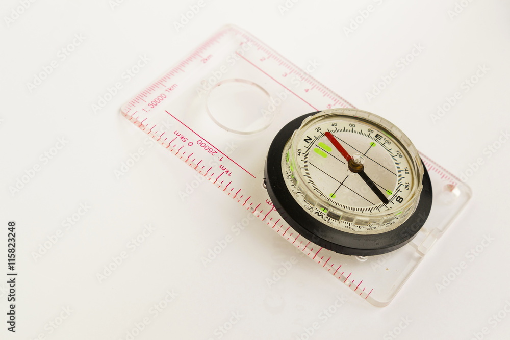 Detail shot of a glass compass on white background Detail shot of a glass compass on white background