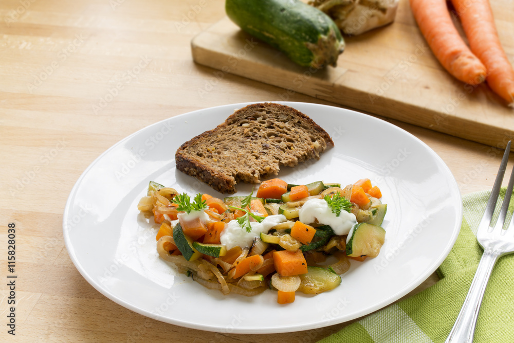 fresh vegetables from zucchini, carrots and celery with soured cream