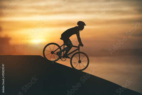 Fototapeta Naklejka Na Ścianę i Meble -  Silhouette of a man on muontain-bike, sunset