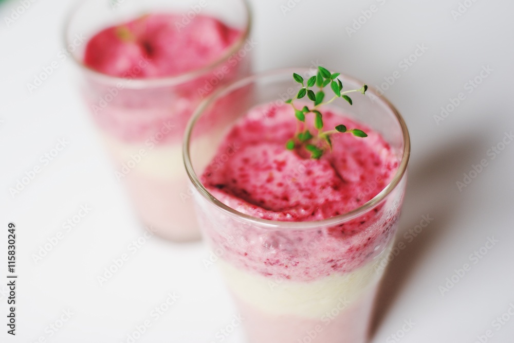Frozen strawberry smoothie sorbet in glass cups, top view.