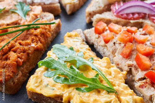 Mix of sandwiches on a stone board