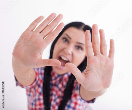Girl showing stop hand gesture