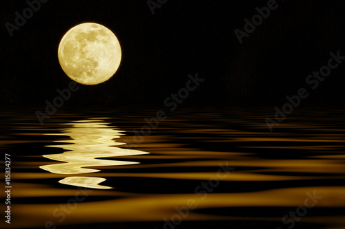 yellow moon over sea