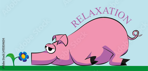 pink pig lying and resting on the grass and smelling a flower