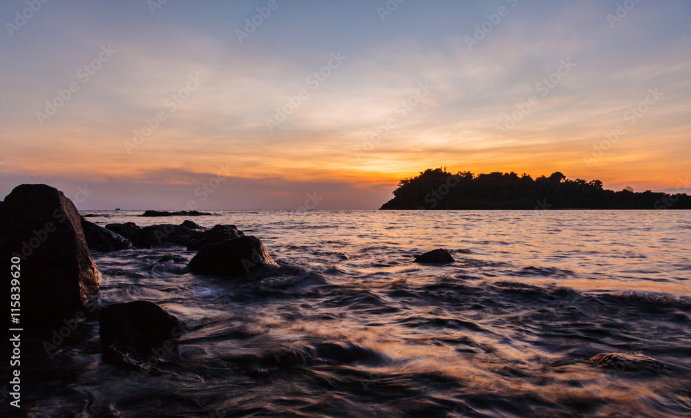 Coast and small island sea scape at sunset