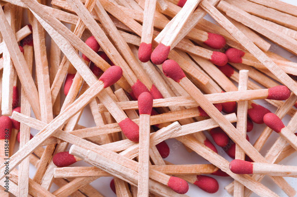 Close-up of red matches on white background