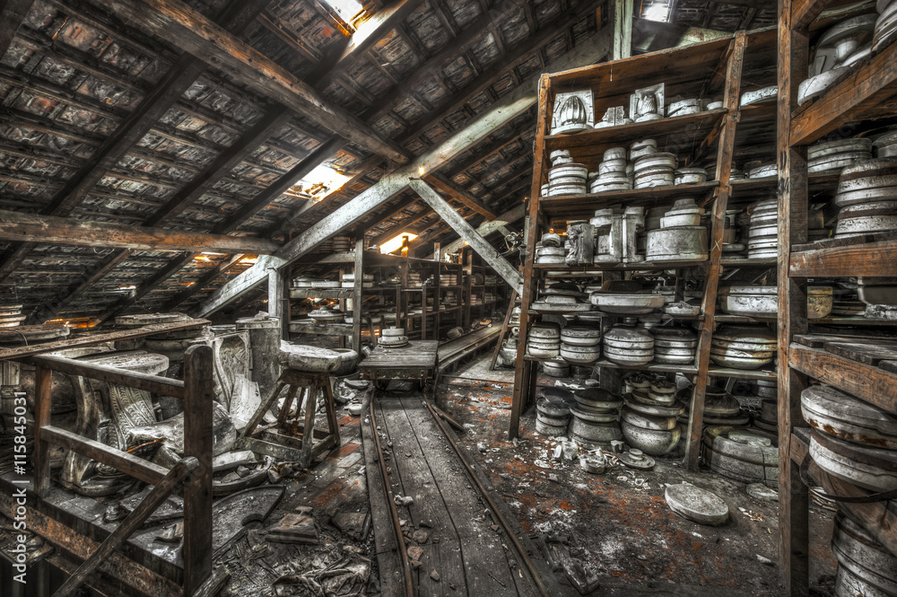 Shelves of clay moulds at an abandoned ceramics factory