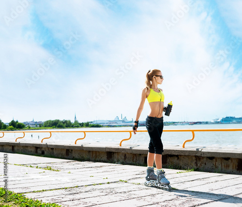 Young and fit woman rollerblading on skates