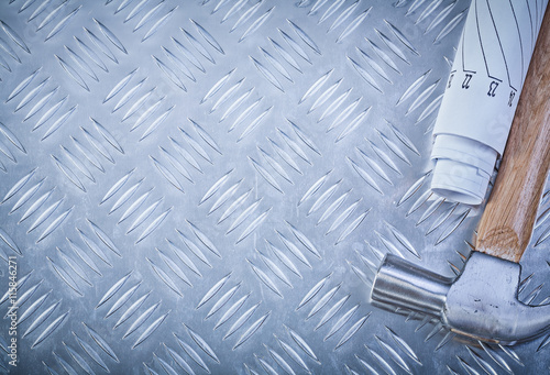 Claw hammer blueprints on grooved metal sheet copy space constru