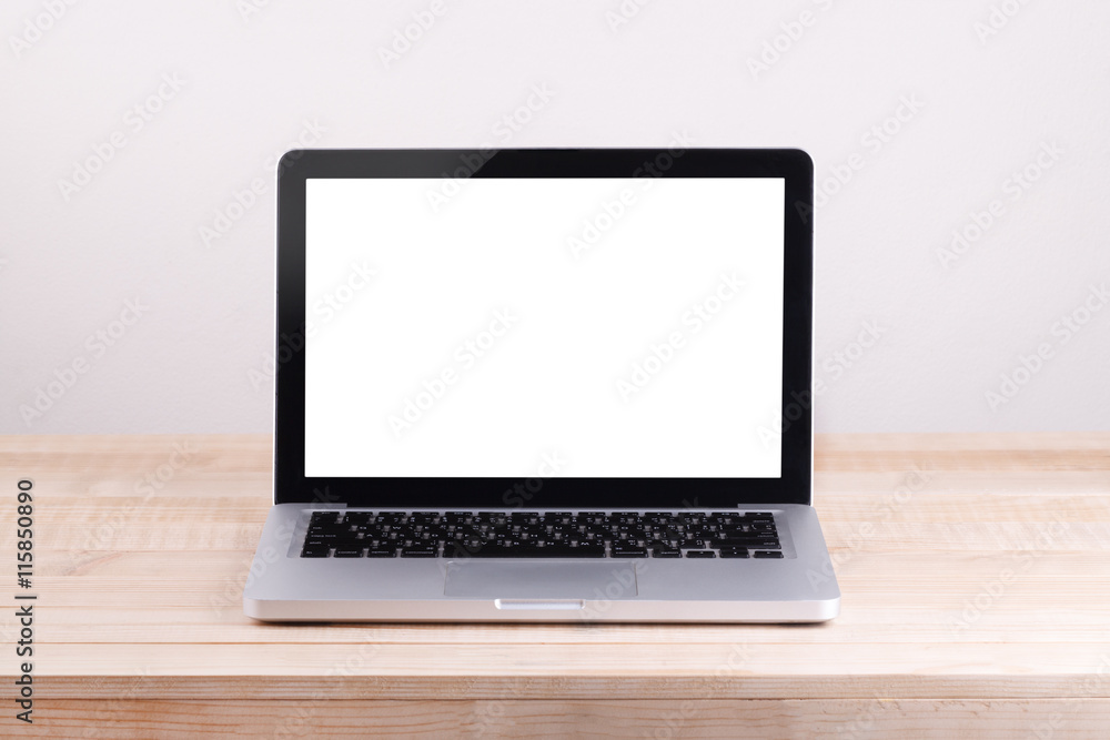 Front view of the laptop is on the work table concrete backgroun Front view of the laptop is on the work table concrete backgroun