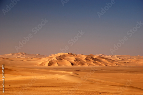 Panoramic view of sand dunes in desert Oman
