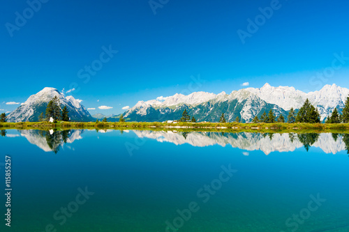 Mountains reflecting in lake water