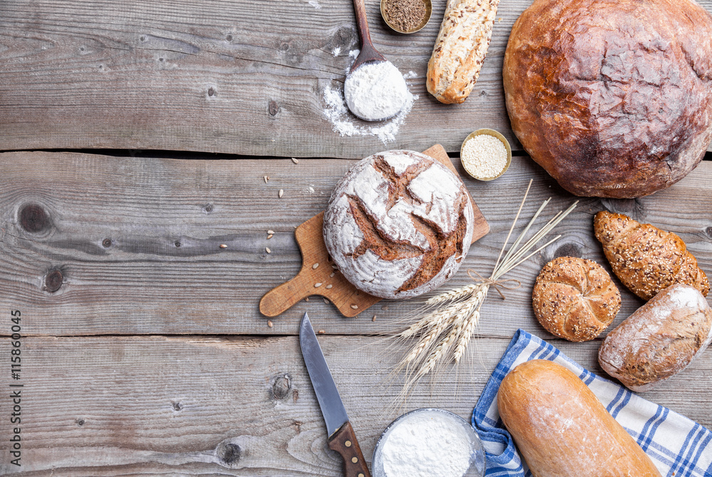 Delicious fresh bread on wooden background Delicious fresh bread on wooden background