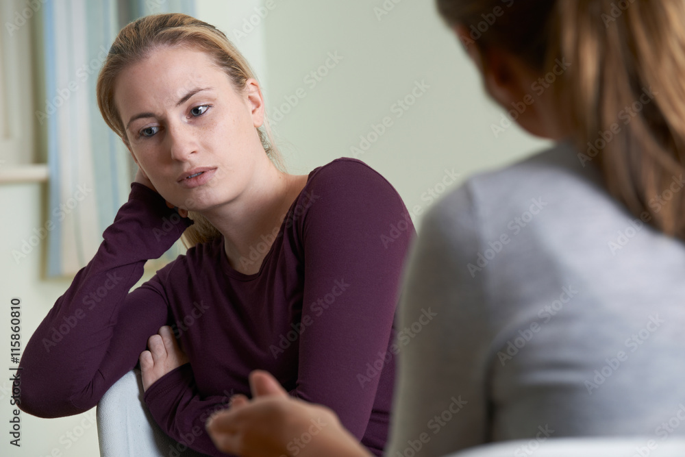 Young Woman Discussing Problems With Counselor Young Woman Discussing Problems With Counselor