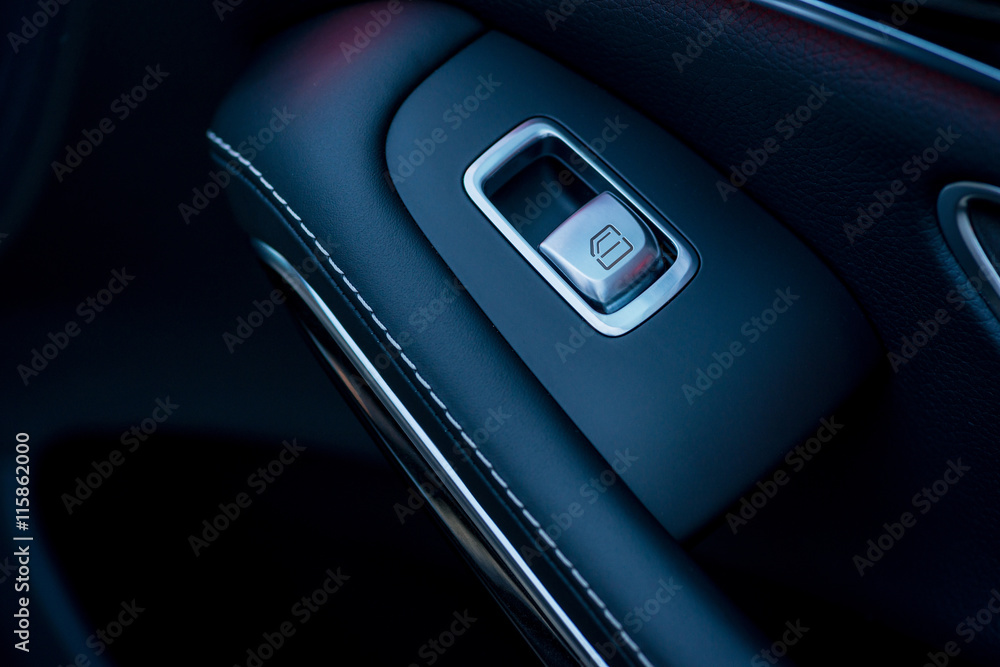 Luxury car interior. Door, seat and window controls Luxury car interior. Door, seat and window controls