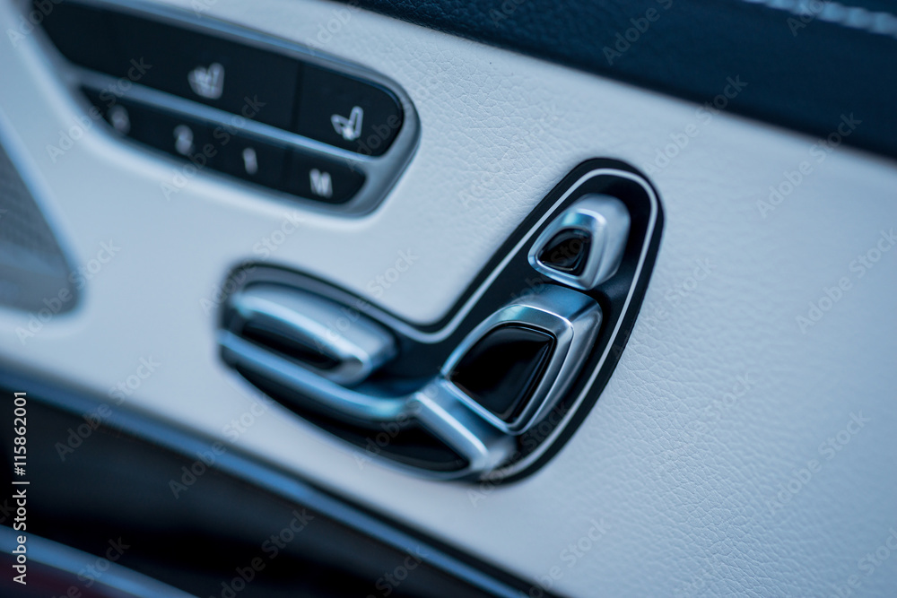 Luxury car interior. Door, seat and window controls Luxury car interior. Door, seat and window controls
