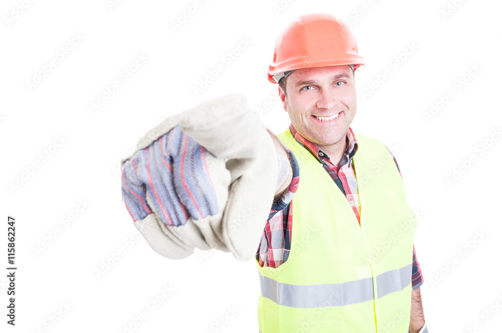Handsome smiling builder pointing finger at you Handsome smiling builder pointing finger at you