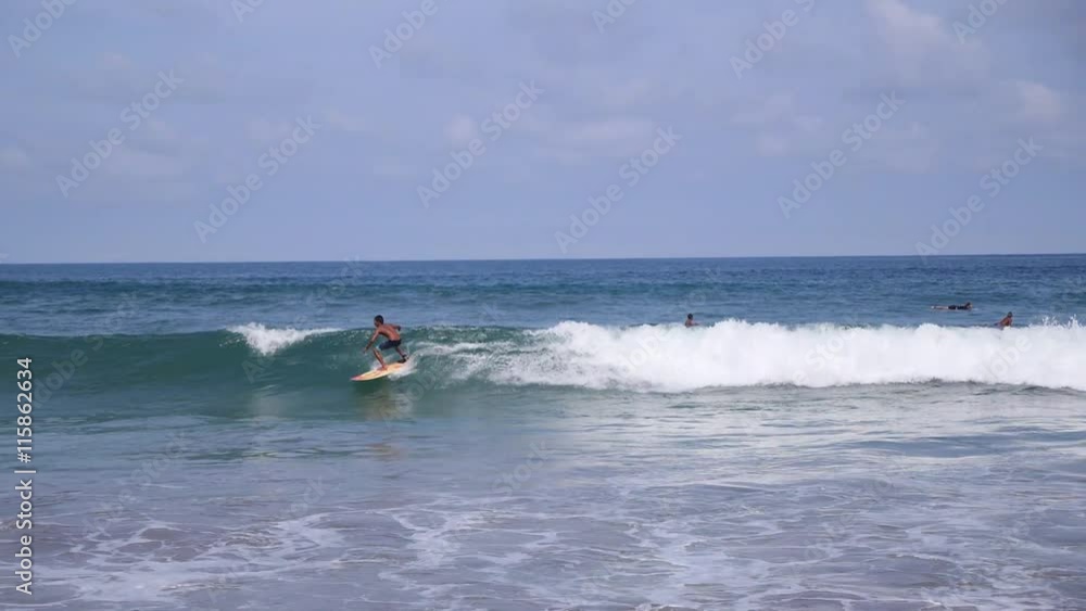 Surf Boy Surfing on Waves in Ocean in Summer. Slow Motion. Surf Boy Surfing on Waves in Ocean in Summer. Slow Motion.
