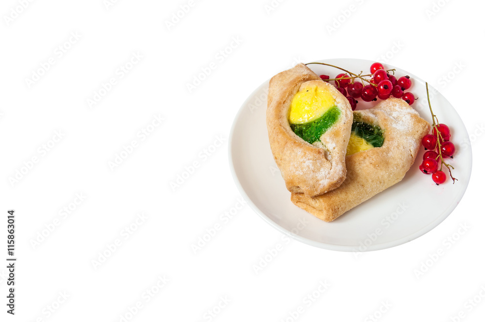 Bake isolated. Scones with jam on a plate. Pastry sprinkled with chocolate. Red currant. Bake isolated. Scones with jam on a plate. Pastry sprinkled with chocolate. Red currant.