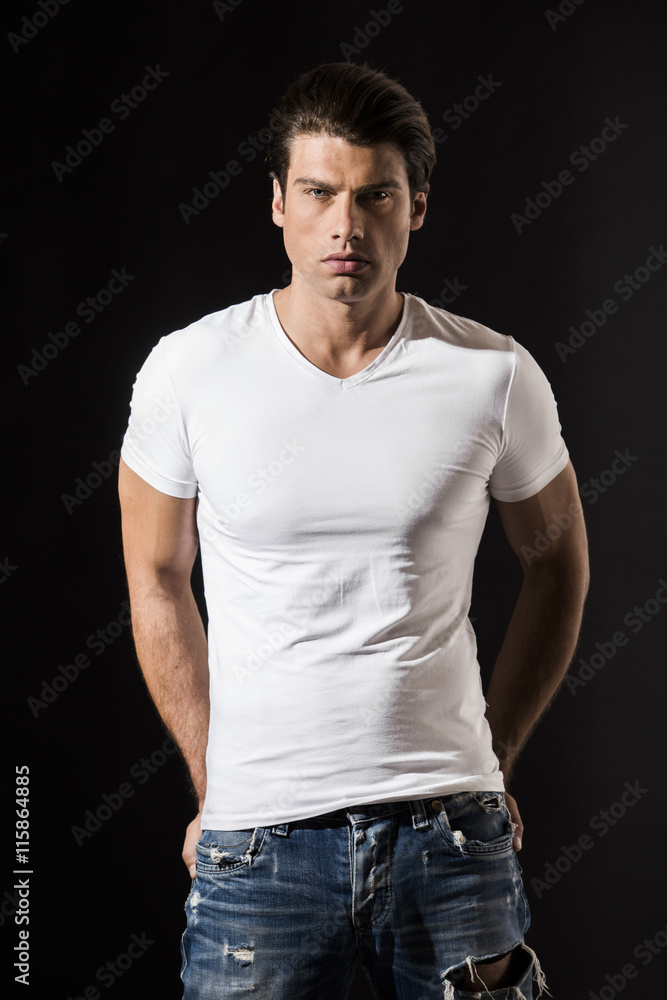 Handsome man in white t-shirt and jeans Handsome man in white t-shirt and jeans