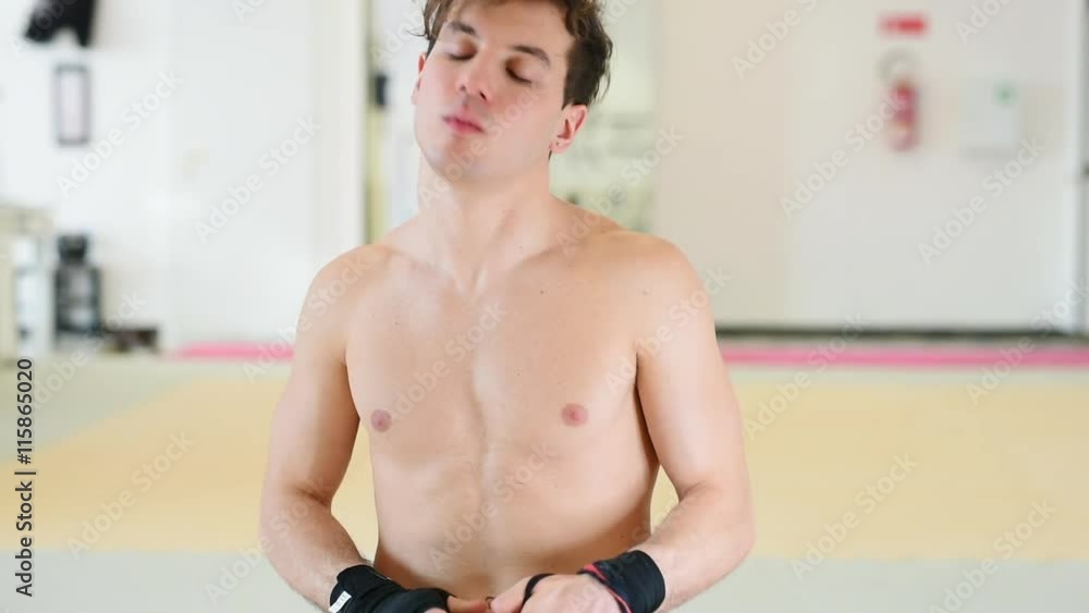 Martial artist bandaging hands