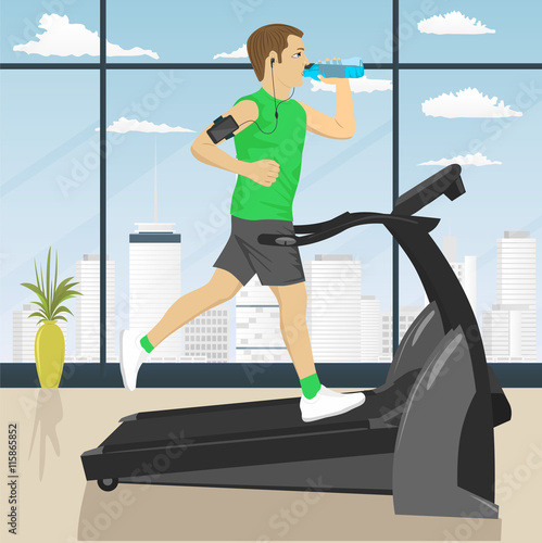 man at gym doing exercise on the treadmill with smartphone armband drinking water