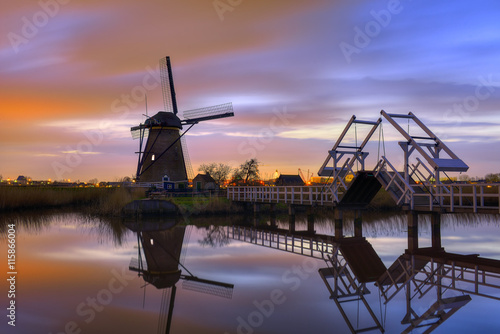 Windmills at  twilight after sunset in the famous kinderdijk, Netherlands