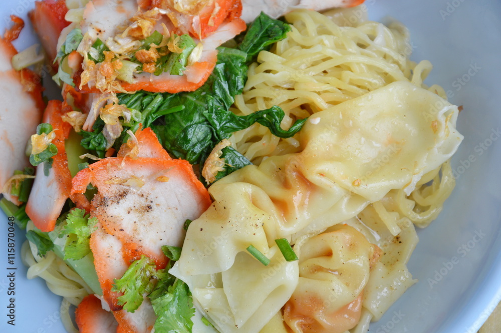 yellow noodle topping barbecue pork and dumpling on bowl yellow noodle topping barbecue pork and dumpling on bowl