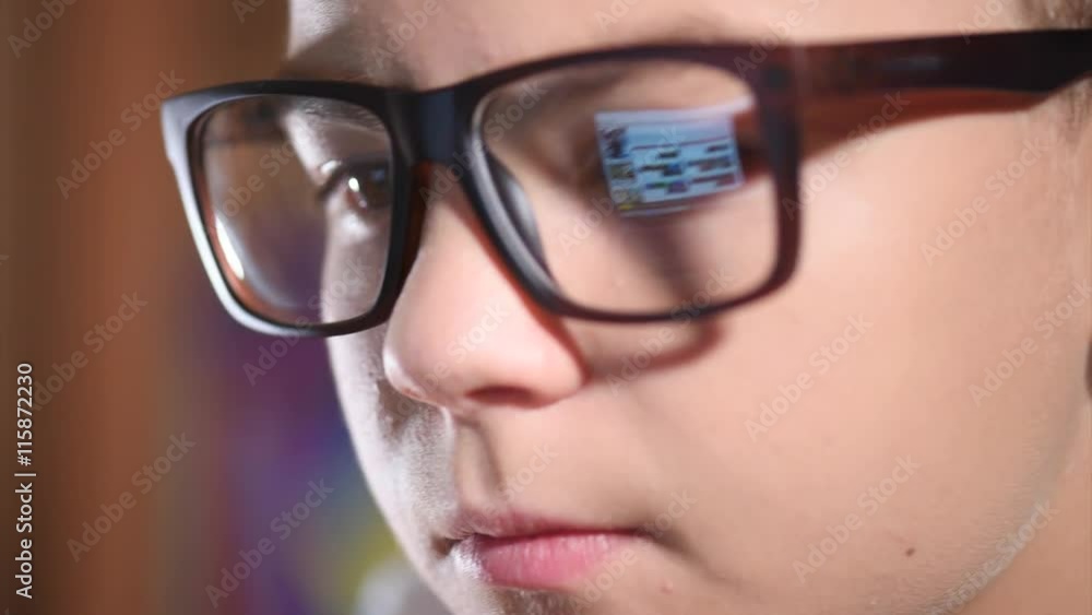 Teen boy working on laptop Teen boy working on laptop