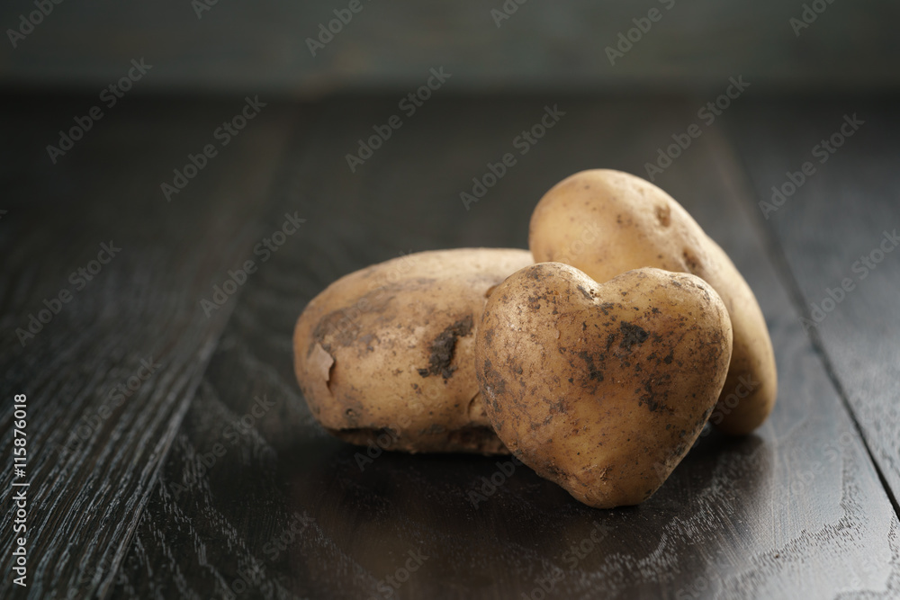 heart shaped potatoes on black oak table heart shaped potatoes on black oak table