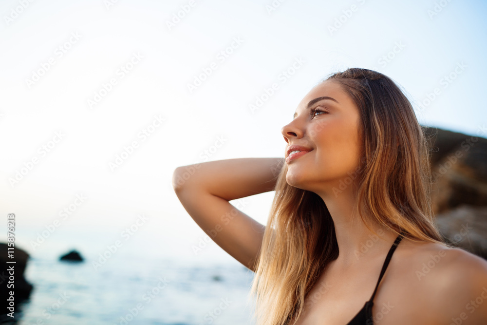 Beautiful young girl rests at morning beach Beautiful young girl rests at morning beach