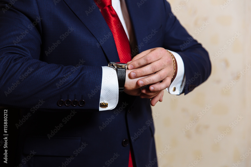 Businessman hands with cufflinks and clocks. Elegant gentleman clother Businessman hands with cufflinks and clocks. Elegant gentleman clother