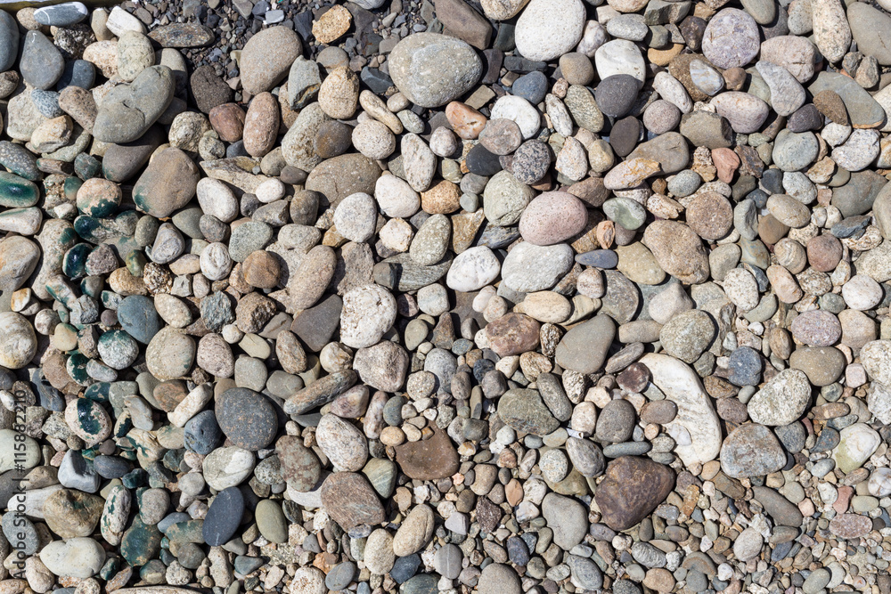Colorful pebbles pattern texture at beach coast Colorful pebbles pattern texture at beach coast
