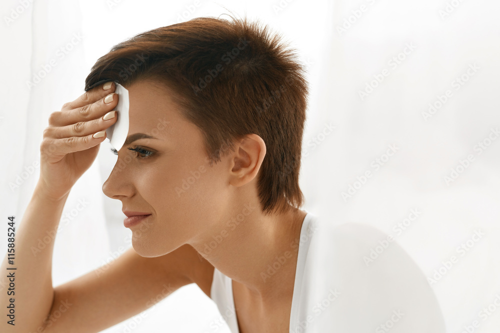 Skin Care. Woman Cleaning Face With Oil Absorbing Papers. Skin Care. Woman Cleaning Face With Oil Absorbing Papers.