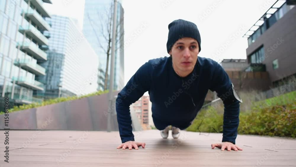 Doing push-ups and listening to music